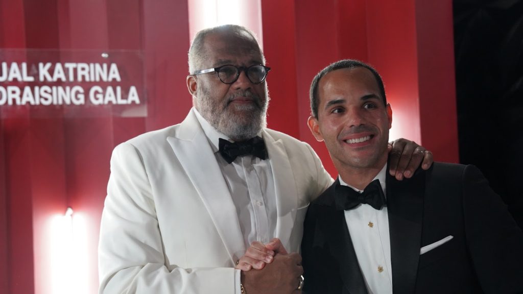 Two gentlemen dressed in formal attire posing at a Katrina Gala event, photographed by The Palmetto Studios in New Orleans.